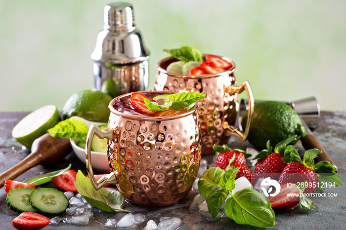 Moscow mule cocktail with lime and strawberry