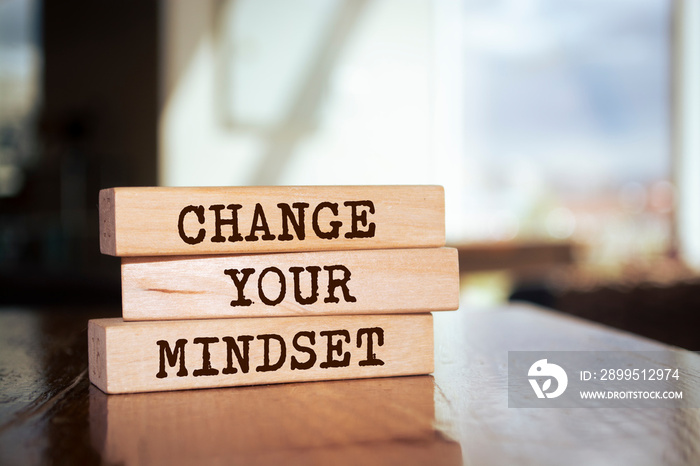 Wooden blocks with words ’Change Your Mindset’.