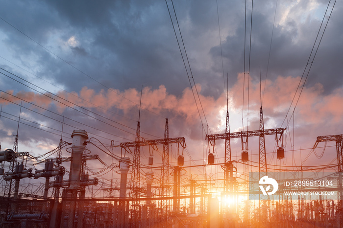 Thermal power stations and power lines during sunset.