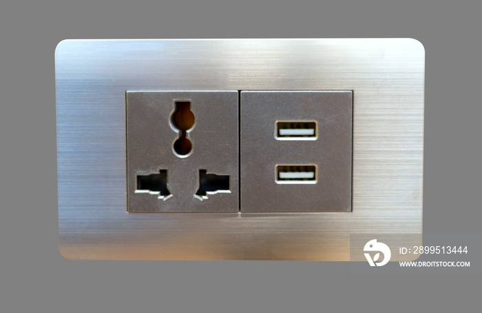 Electric wall plug socket and USB charging port isolate on gray background.
