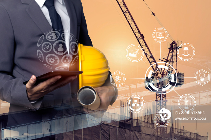 Double exposure engineering using digital technology interfaces icon with construction cranes no city background.