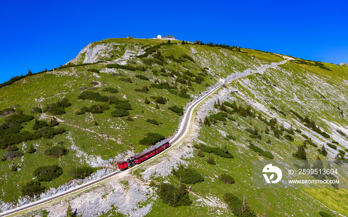 The SchafbergBahn is the steepest cogwheel railway in Austria. Since 1893 mighty steam locomotives have powered their way from the lake-side base station in St. Wolfgang to the 1783 m high