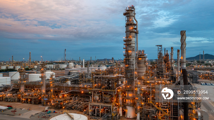 Oil refinery plant from industry zone, Aerial view oil and gas petrochemical industrial, Refinery plant chemical factory oil storage tank and pipeline steel.