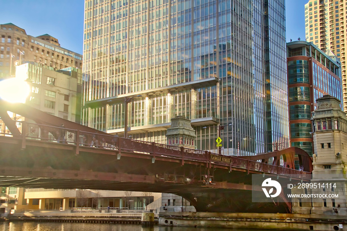 Downtown Chicago Loop Business District during Rush Hour and Sunset, View Looking Up from The Riverwalk to see Lasalle Street Bridge over Chicago River