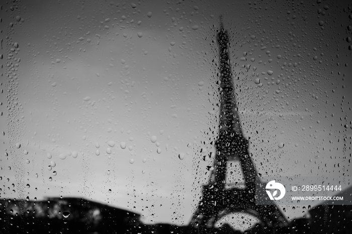 Paris Eiffel Tower through window at rainy weather