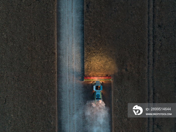 Bird’s Eye View of a Combine Harvester Working at Night