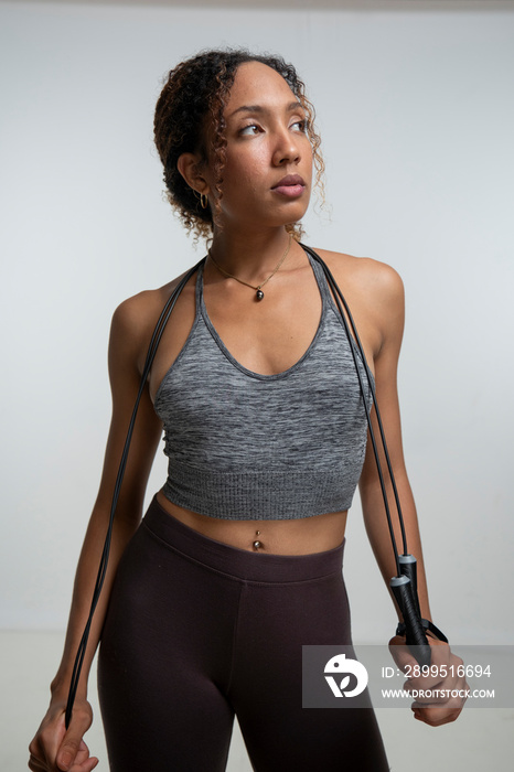 Portrait of woman with jump rope during training