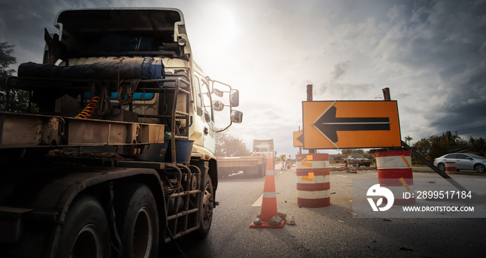 Truck with Traffic cones and   Diversion  sign outside a construction zone.