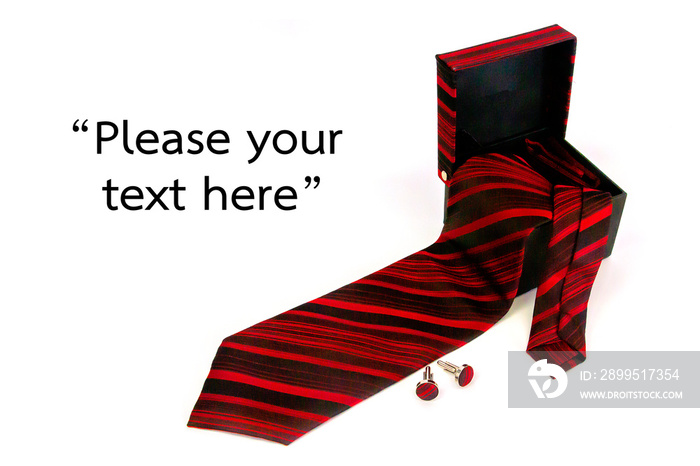 Necktie with red and black stripes in an open gift box, a business gift present on a white background with a text area.