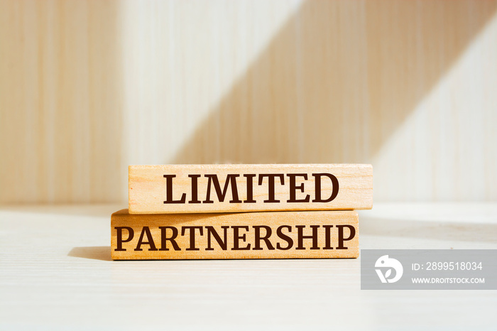 Wooden blocks with words ’Limited partnership’. Business concept