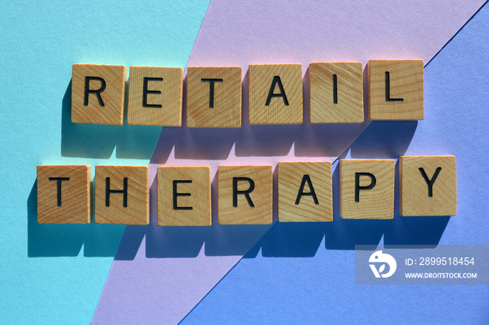 Retail therapy, words in wood alphabet letters isolated on coloured background