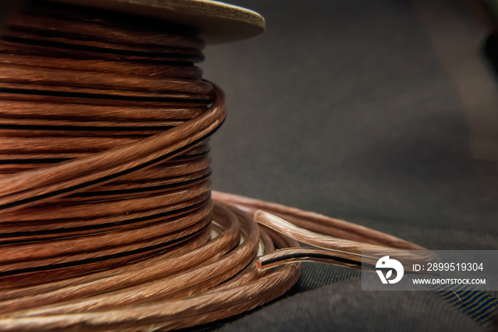 speaker wire coil on grey background