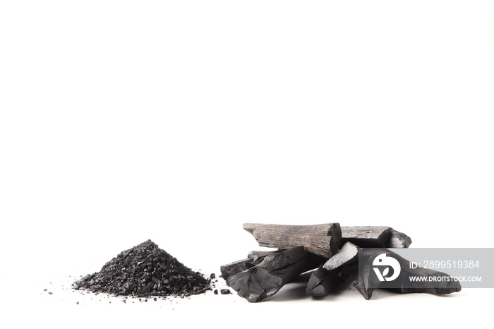 Charcoal and powder (activated carbon) on white background. Free space for text