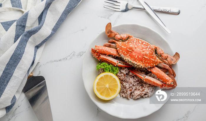 Cooked Steamed blue crab on white plate food concept background, top view