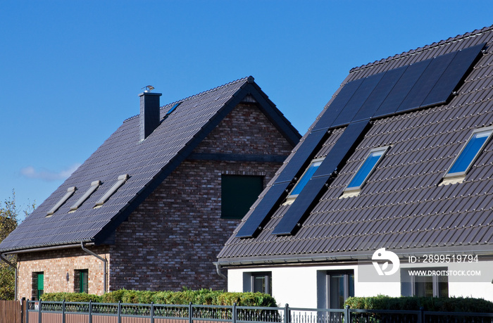 Modern solar panels on rooftop of private house