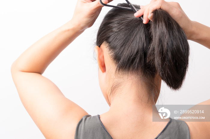 rear view of women tightening the hair, lifestyle concept