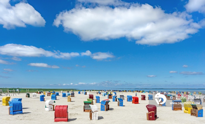 A seaside scene with colourful chairs on the beach in Germany