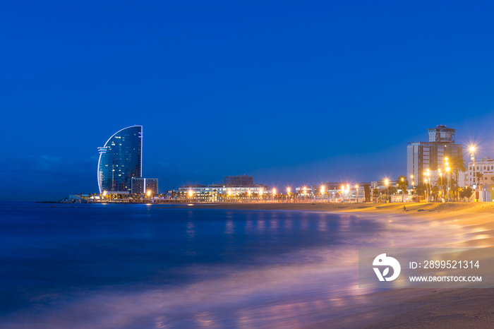 Barcelona Beach in summer night along seaside in Barcelona, Spain. Mediterranean Sea in Spain.