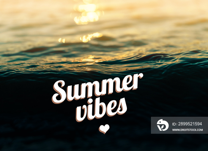 Beautiful summer vibes quote in callygraphic font, white text on sea waves background during sunset. Vintage nostalgic colors, strong contrast.