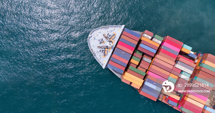 Aerial of cargo ship carrying container and running for export  goods  from  cargo yard port to other ocean concept freight shipping ship on blue sea , logistic service transportation.