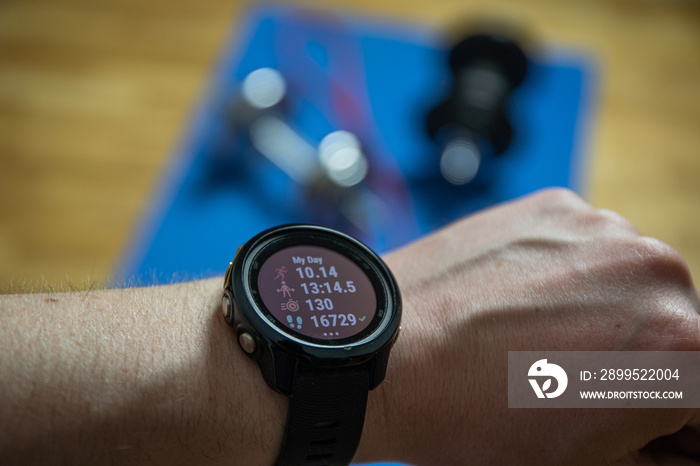 Workout at home. Close up shot of smartwatch which shows productive training. Sport watch shows info about workouts.