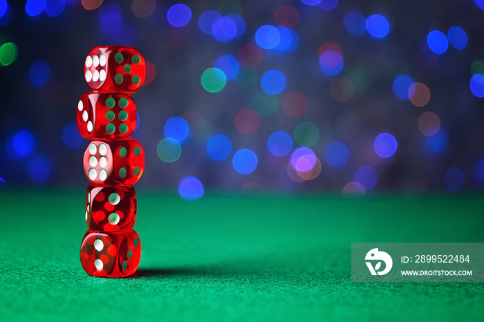 Dices on green table in casino