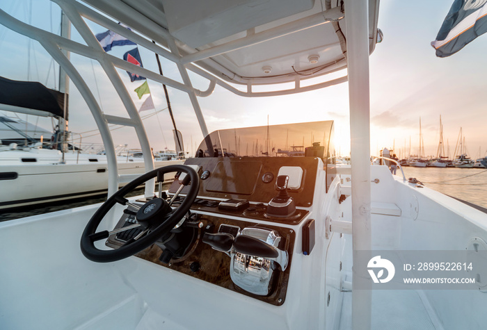 A modern speed boat yacht steering wheels.