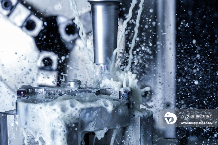 a process of vertical cnc steel milling with external water coolant streams and splashes