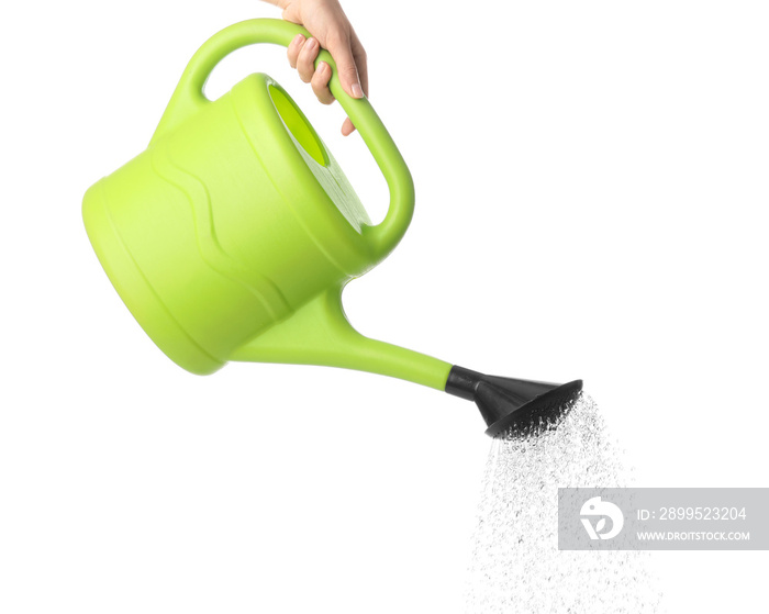 Hand with watering can on white background