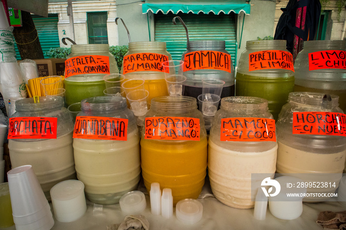 Various Flavors of Aguas Frescas in Jars at Market in Mexico City