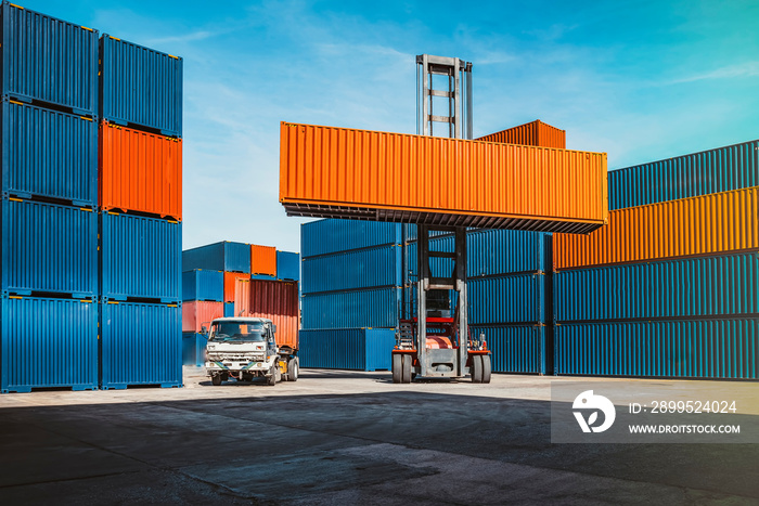 In the shipping industry, a forklift truck raises cargo containers.