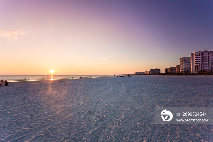 Marco Island famous beach and calmed ocean during sunset, Florida, USA. Amazing cloudscape after a big tropical storm in the Gulf of Mexico, close to Everglades National Park