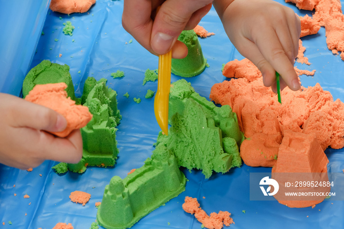 kid play kinetic sand