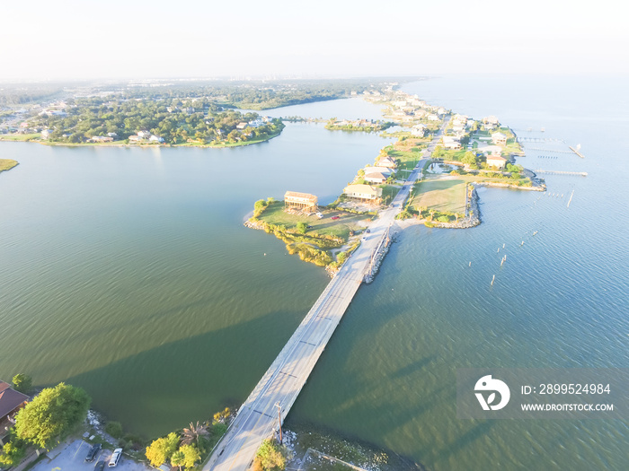 Aerial view of Seabrook city near Texas Gulf Coast and Clear Lake. Waterfront harbor town with pier. Wooden vacation house under construction. Real estate and beach travel background