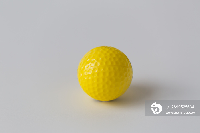 close up of yellow golf ball