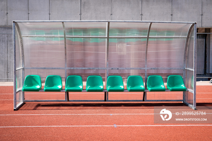 Coach and reserve benches in soccer stadium