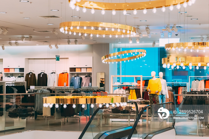 Mannequins Dressed In Female Woman Casual Clothes And Clothes On Shelves And Hanger In Store Of Shopping Center