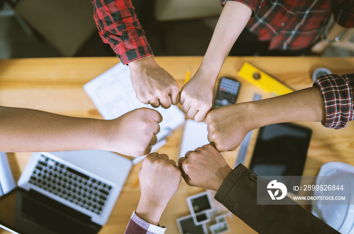 Teamwork concept,Business team standing hands together in office.people joining for cooperation success business,Shaking hands of engineering partnership agreement of Architect engineer  contractor