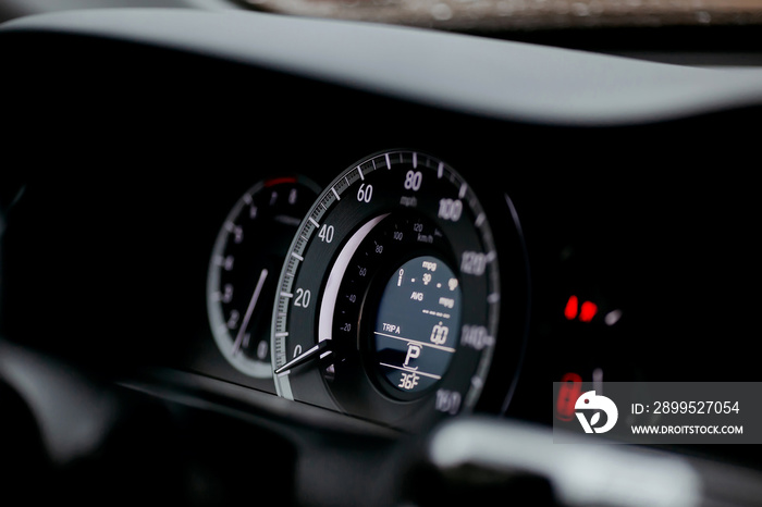 Modern car miles Speedometer close up.