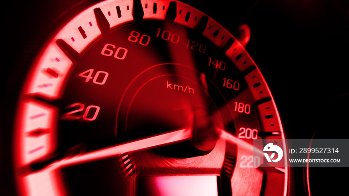 Close up shot of a speed meter in a car with red light speed at 220 Km/H in concept racing car