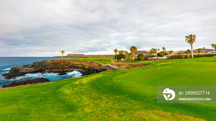 Golf course along rocky coastline. Tenerife, Spain.