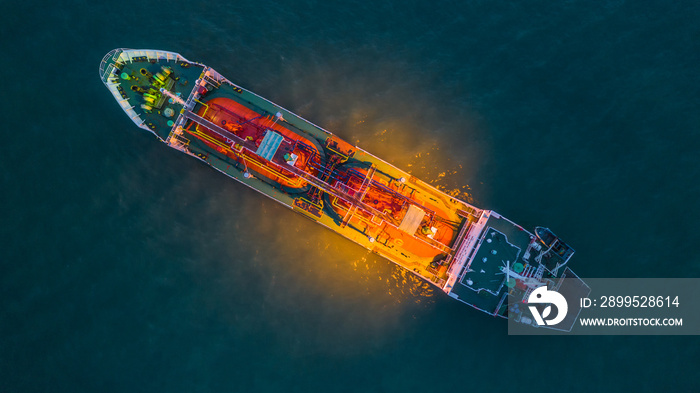 Aerial view oil and gas chemical tanker in open sea at night, Refinery Industry cargo ship.