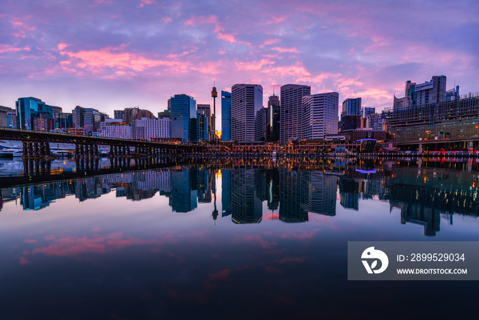 Sydney Tower Eye, View of Sydney skyline from Darling Harbour Bridge with colourful sunrise sky morning, New south wales,  Australia