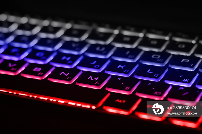 Beautiful colorful modern keyboard with white, blue and red backlight. Backlight of the keyboard in colors of Russian flag