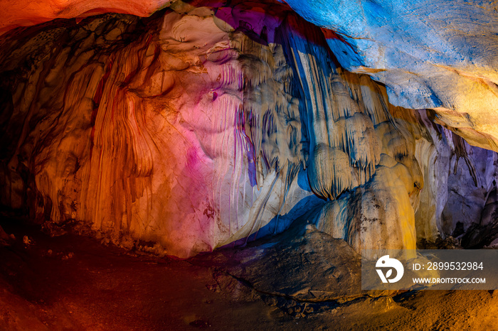 stalactites and stalagmites Natural sculpture from Laplae Cave in Hua Hin District, Thailand, taken using flash lights and various color filters, feels like being in a fairy tale world.