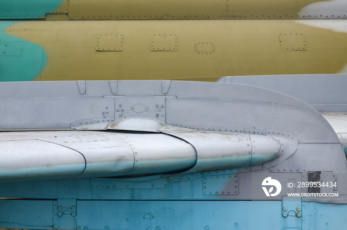 Dirty detailed texture of old fighter aircraft body painted in camouflage with many rivets