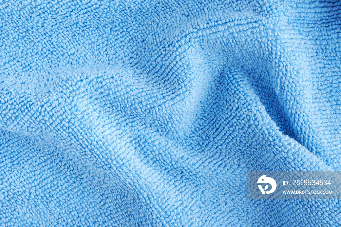 Wrinkled blue microfiber cloth texture of microfiber towel closeup