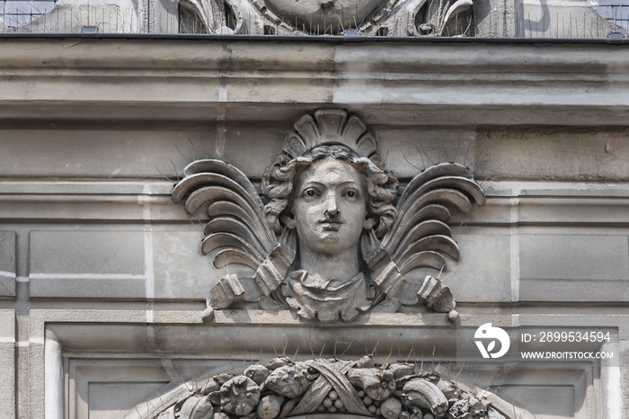 Architectural fragments of XIX arrondissement City hall (inscription: Mairie du XIX Arr, 1878) in Paris. XIX arrondissement called Butte-Chaumont, situated on right bank of River Seine. Paris, France.