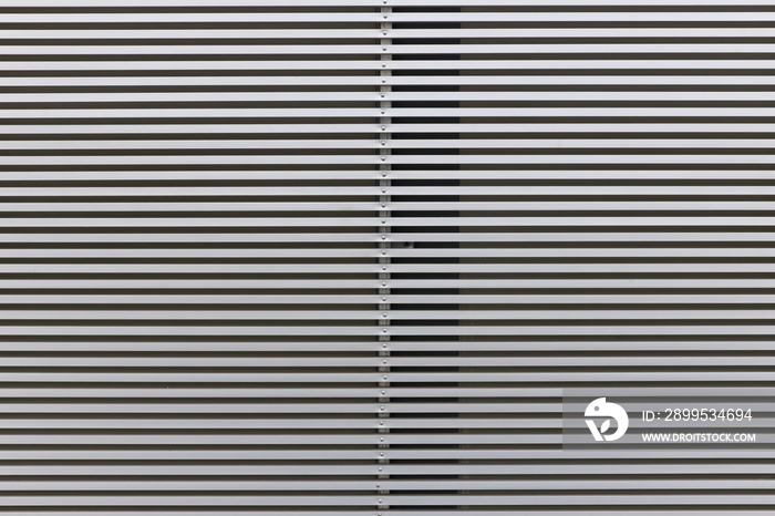 Metal Bars as a Background. Texture of ventilation grille for air intake in office building. Jalousie. Background. Stripes