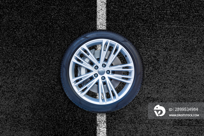 Car wheels isolated on a road background.